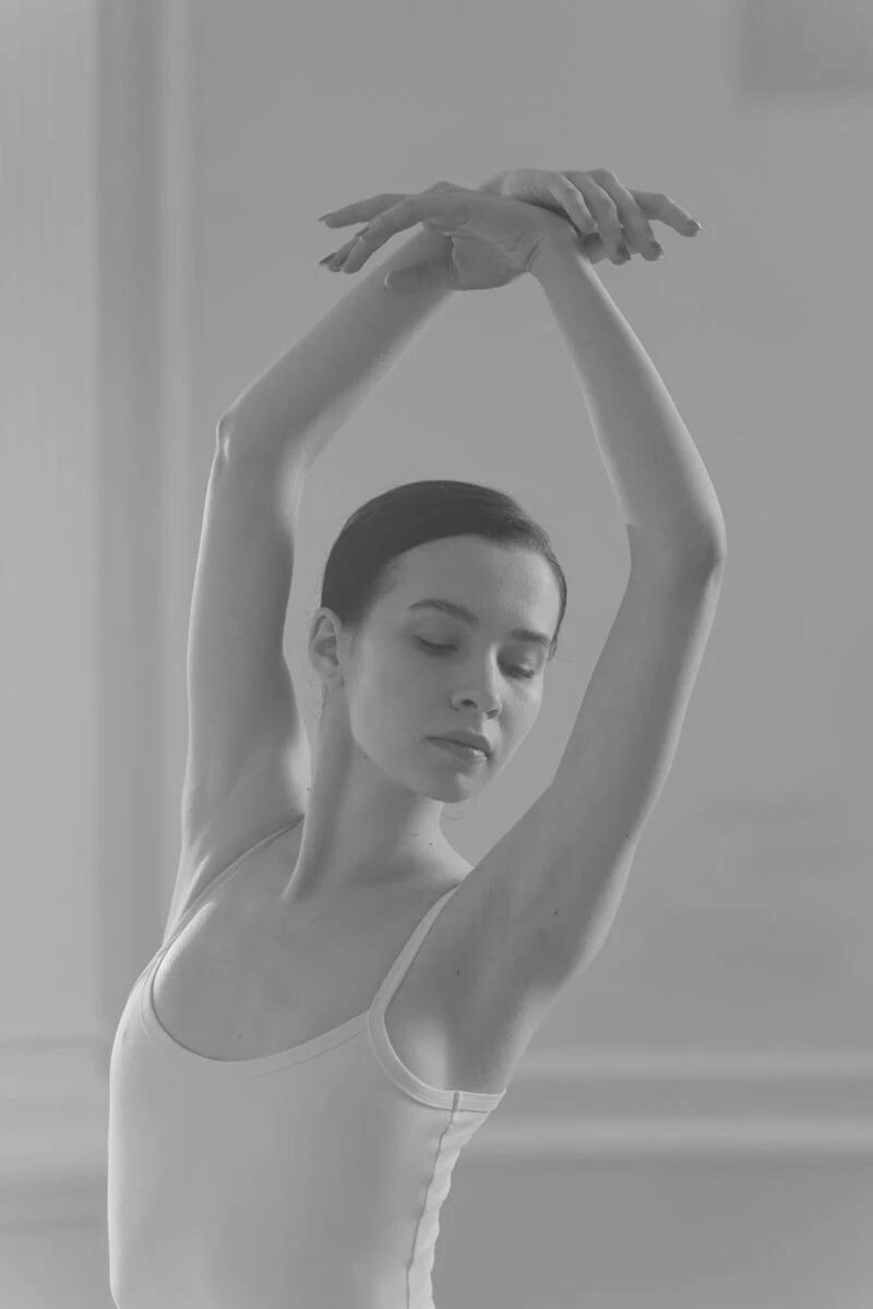 Ballerina with arms in arabesque